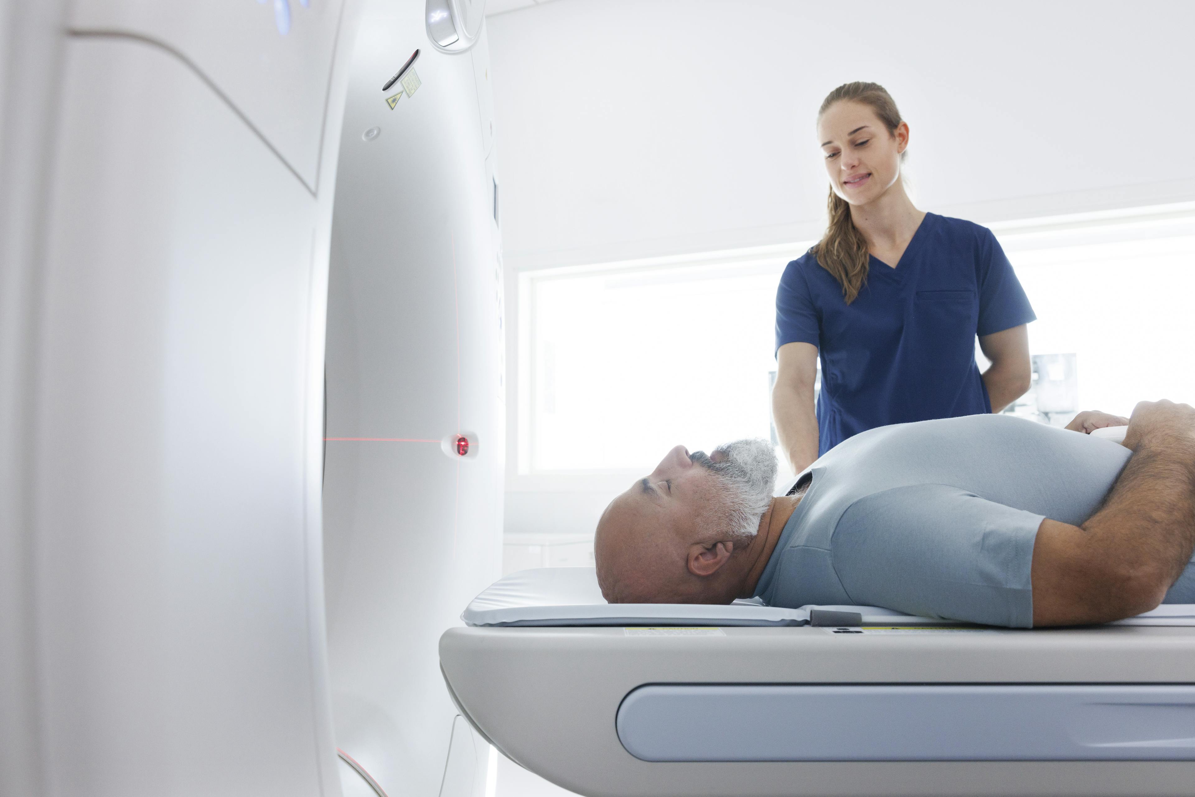 Patient in CT scanner with staff 1370321304.jpg