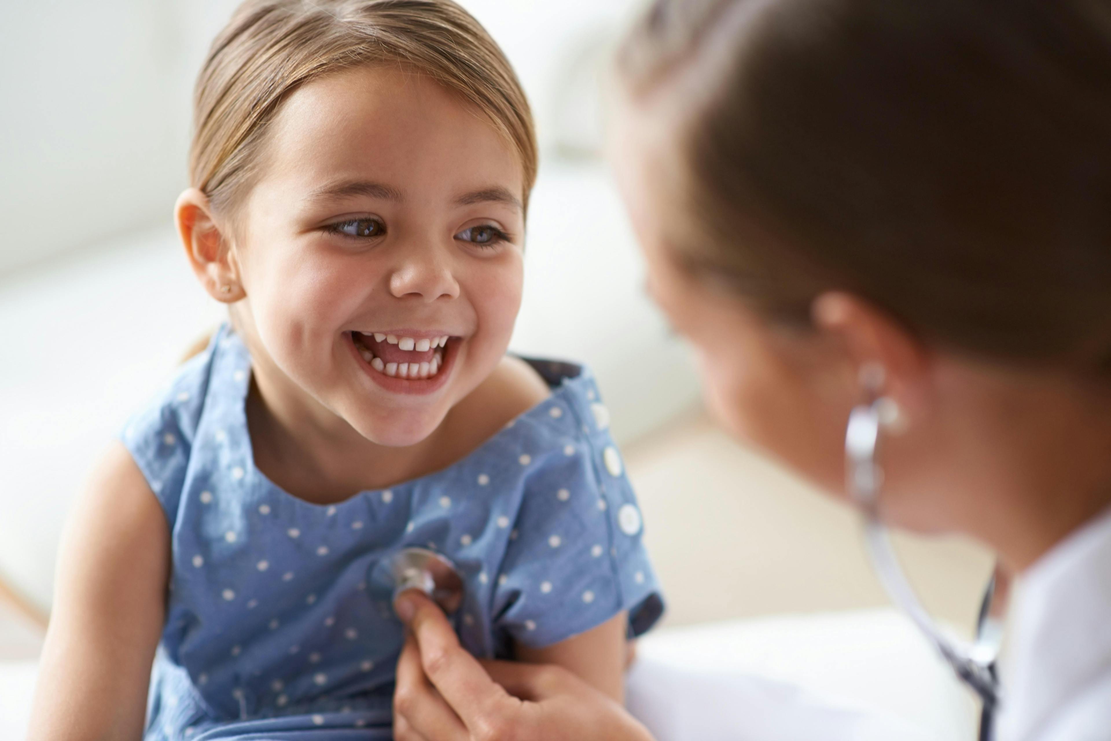 Young girl with paediatrician 489362313.jpg