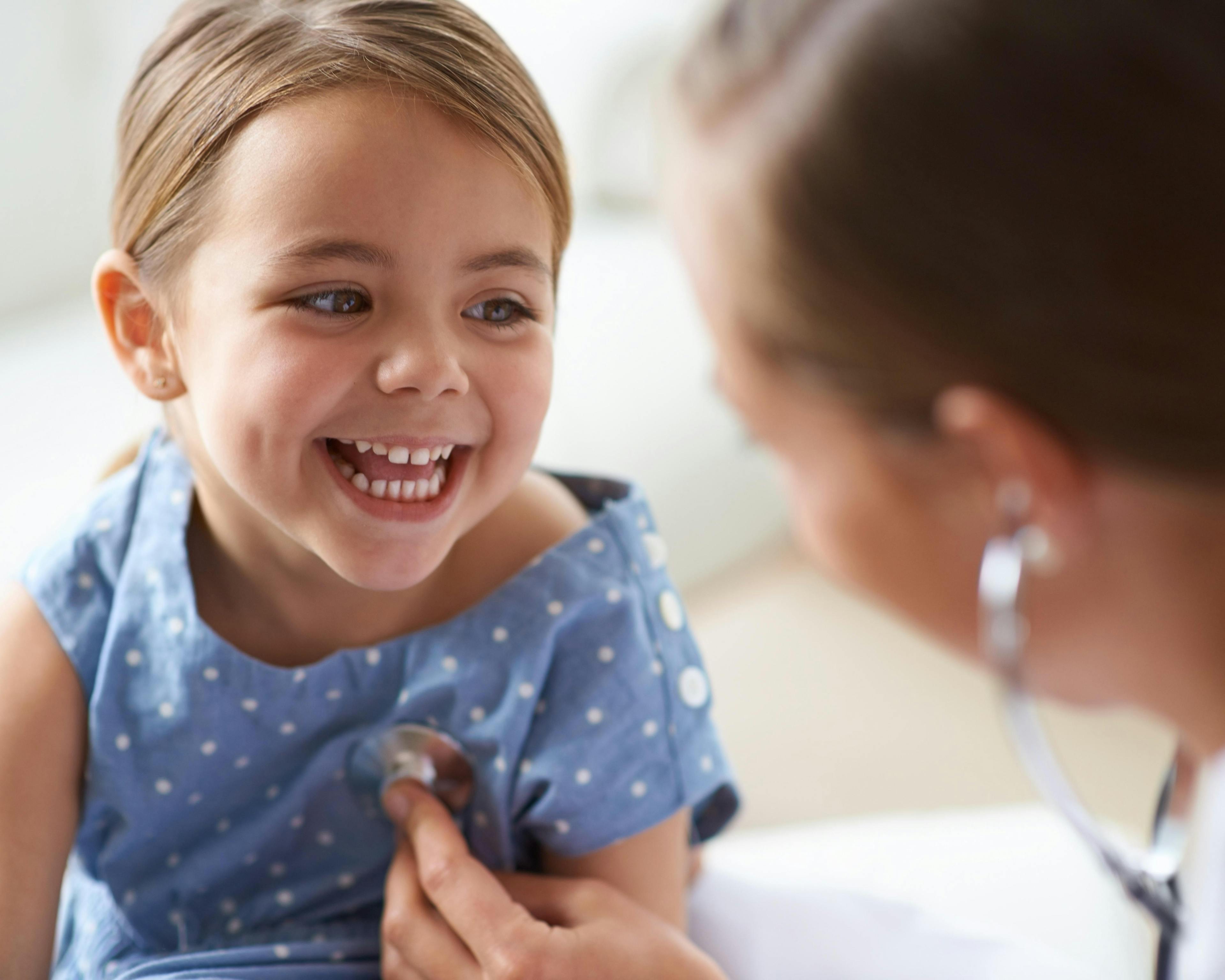 Young girl with paediatrician 489362313.jpg