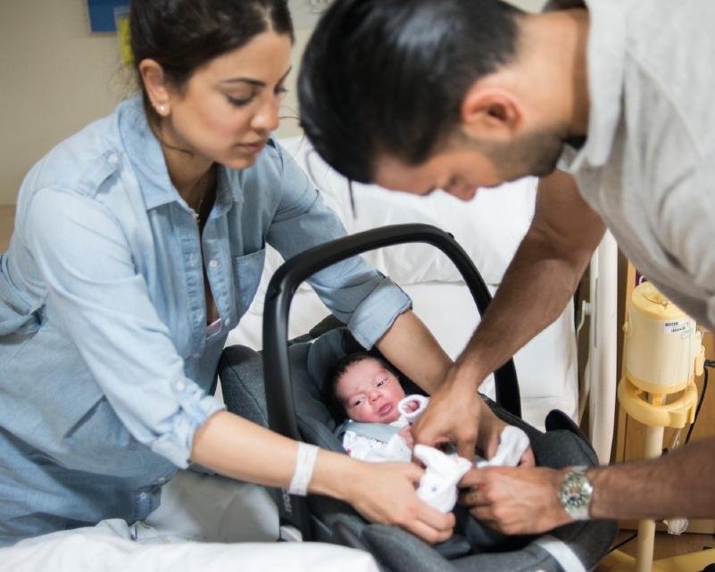 Parents readying baby for discharge