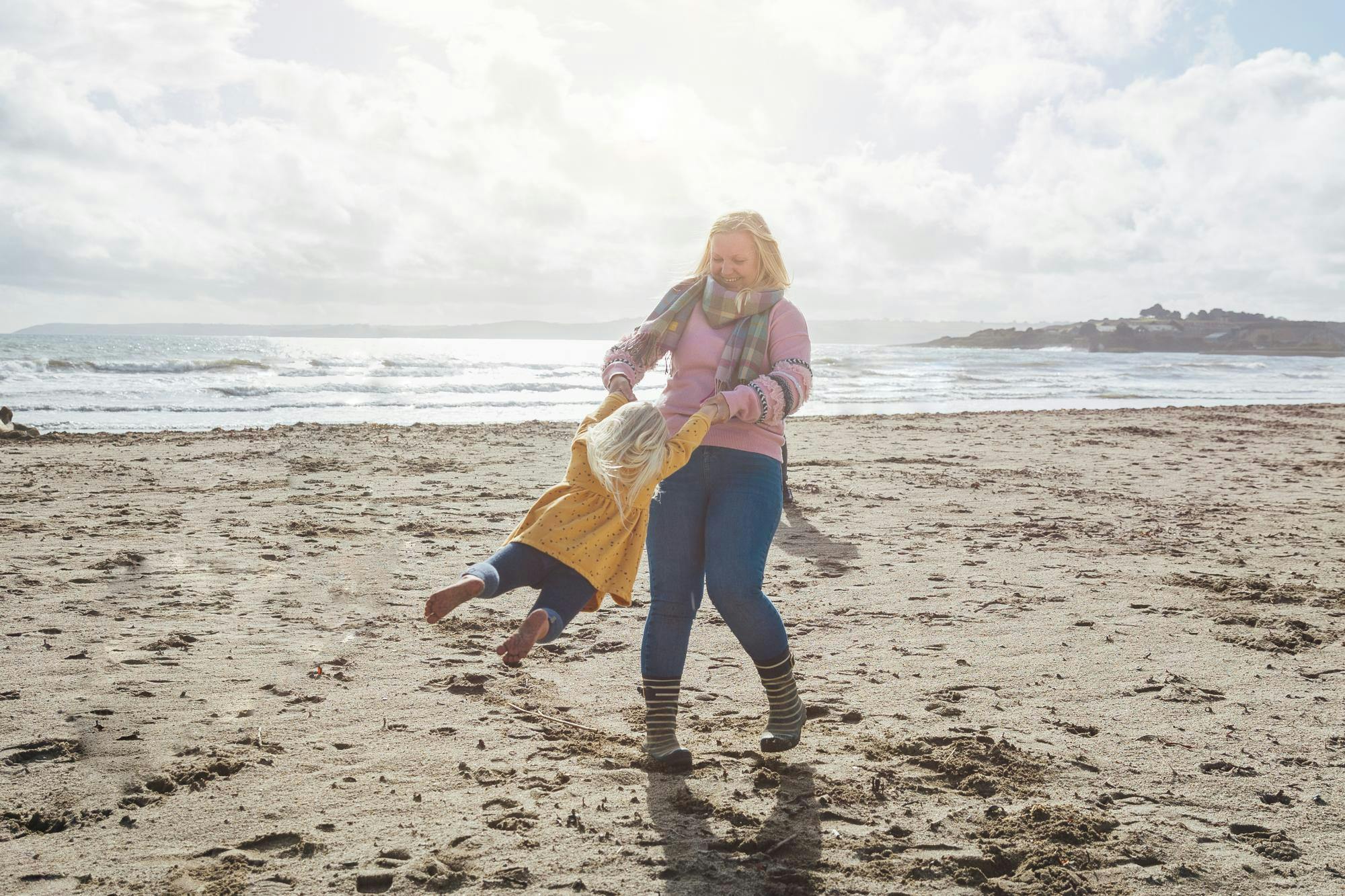 Woman and child playing on beach 1287391872.jpeg