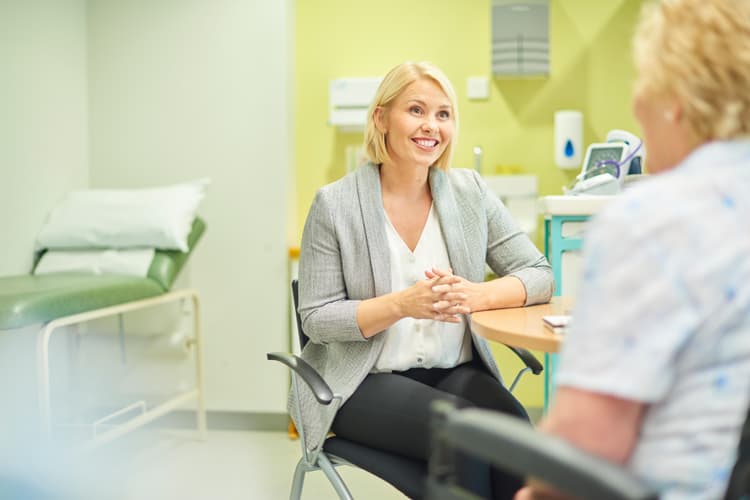 Female gp listening to patient