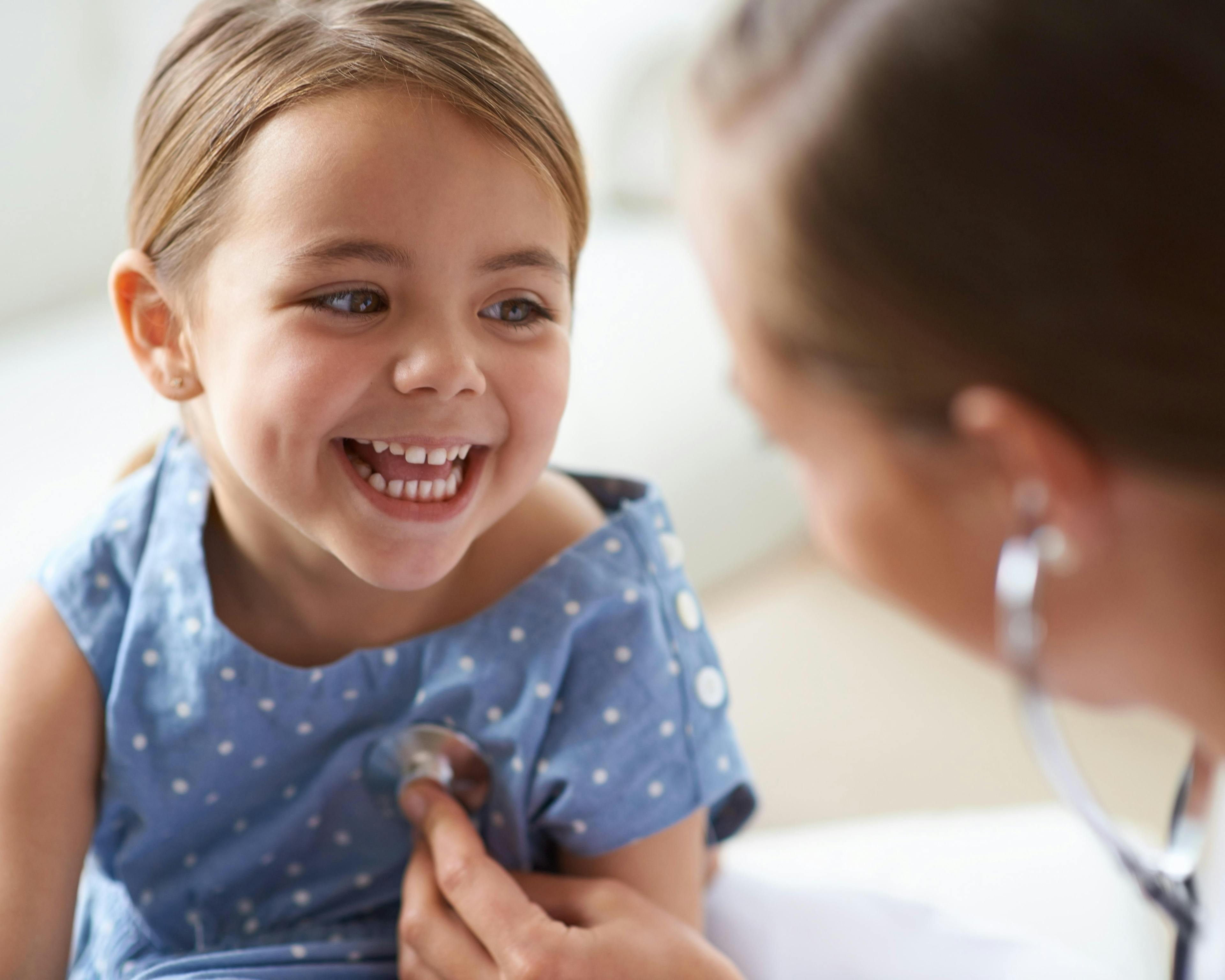 Young girl with paediatrician 489362313.jpg